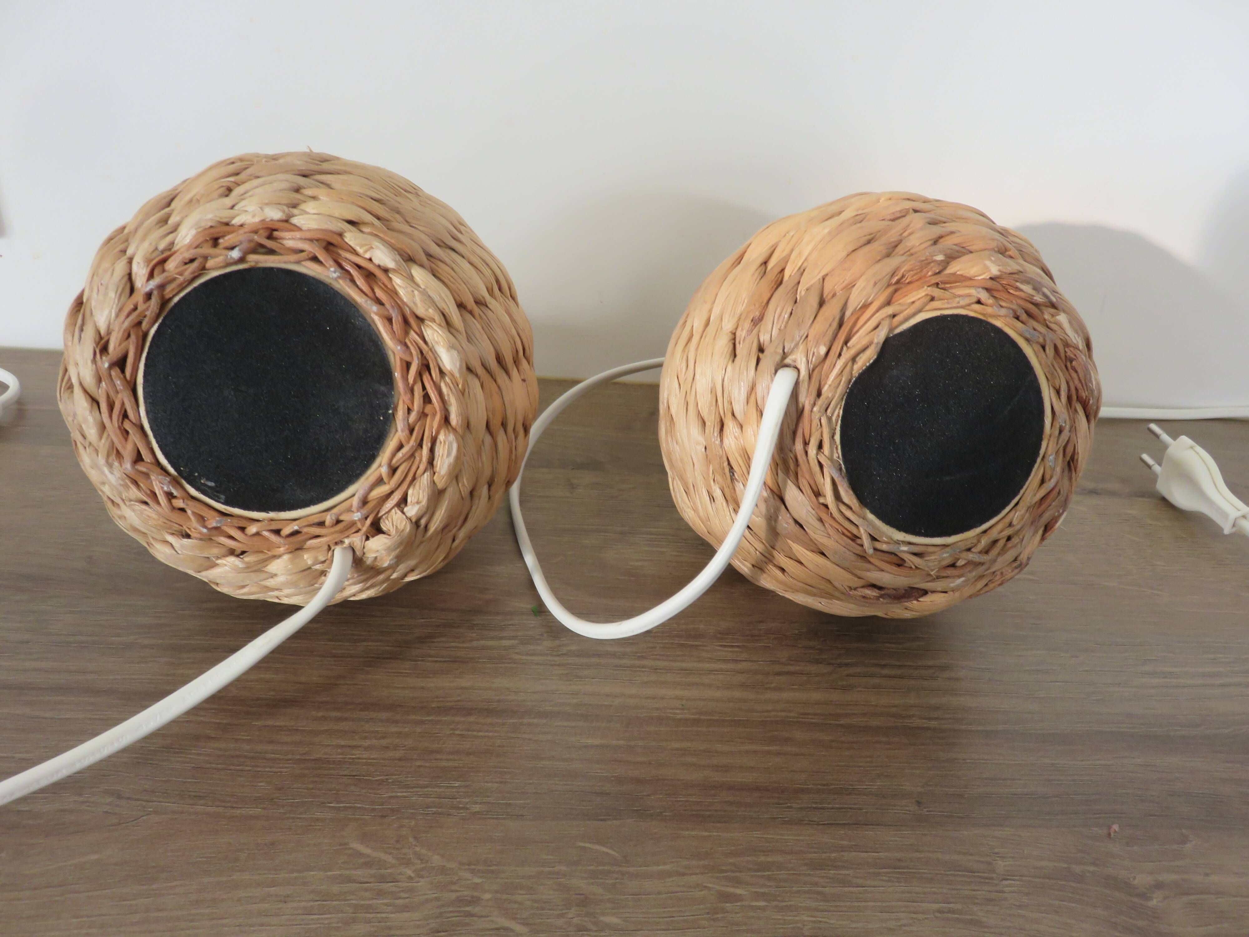 Pair of bedside lamps made of woven sea rush, matching lampshades, 1980.