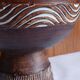 Cup on a pedestal in handcrafted scarified ceramic.