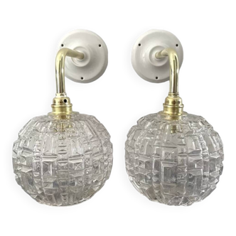 Pair of chiseled glass wall sconces