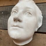 Plaster face wall statue