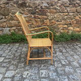 Rattan armchair with armrests