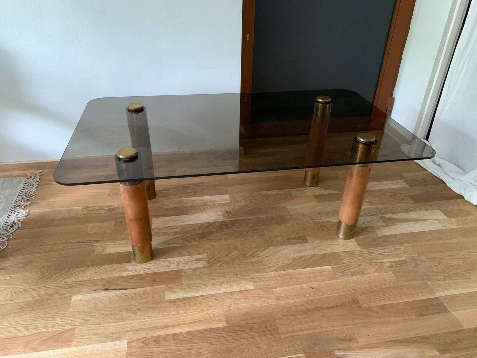 Scandinavian coffee table in brown teak, smoked glass top and brass details, 1960s.