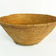 Old large bread basket of baker in braided wicker