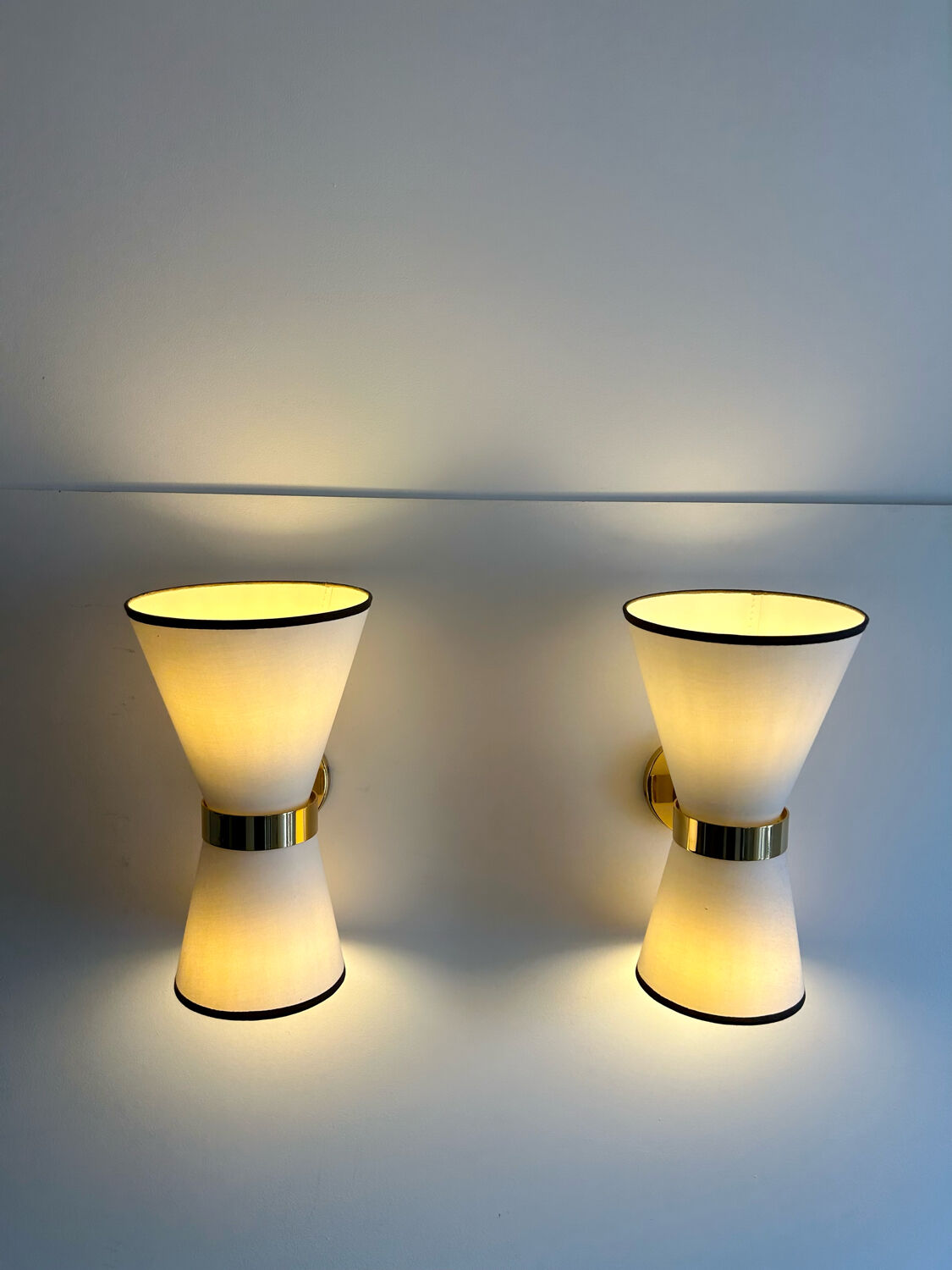Pair of vintage wall lamps, brass and unbleached fabric, Italy 1980