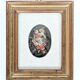 Vintage floral print with oval mat and gold wooden frame.