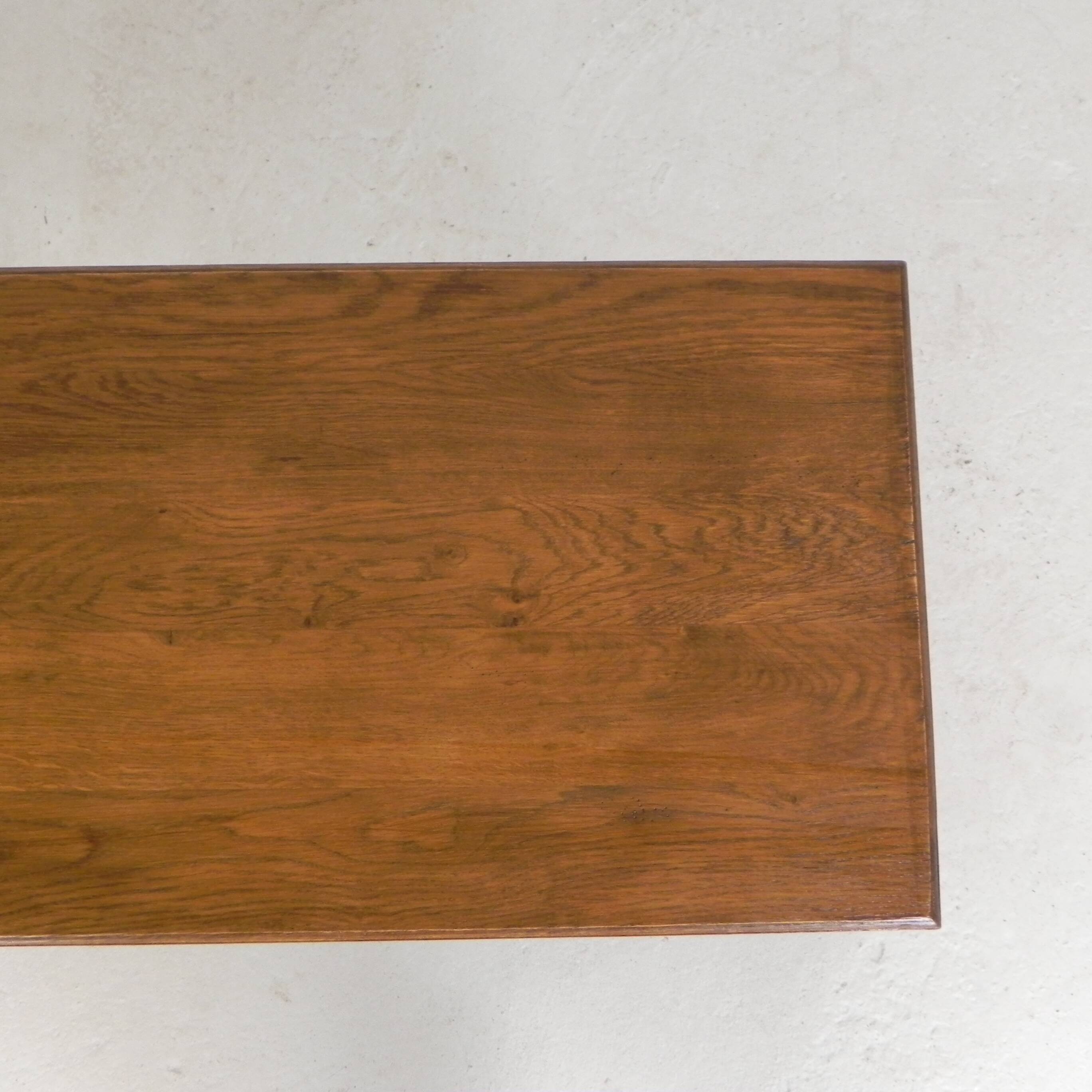 Bistro table with an oak top on a cast iron base, 1930s.