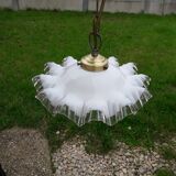 White opaline suspension with toothed edges