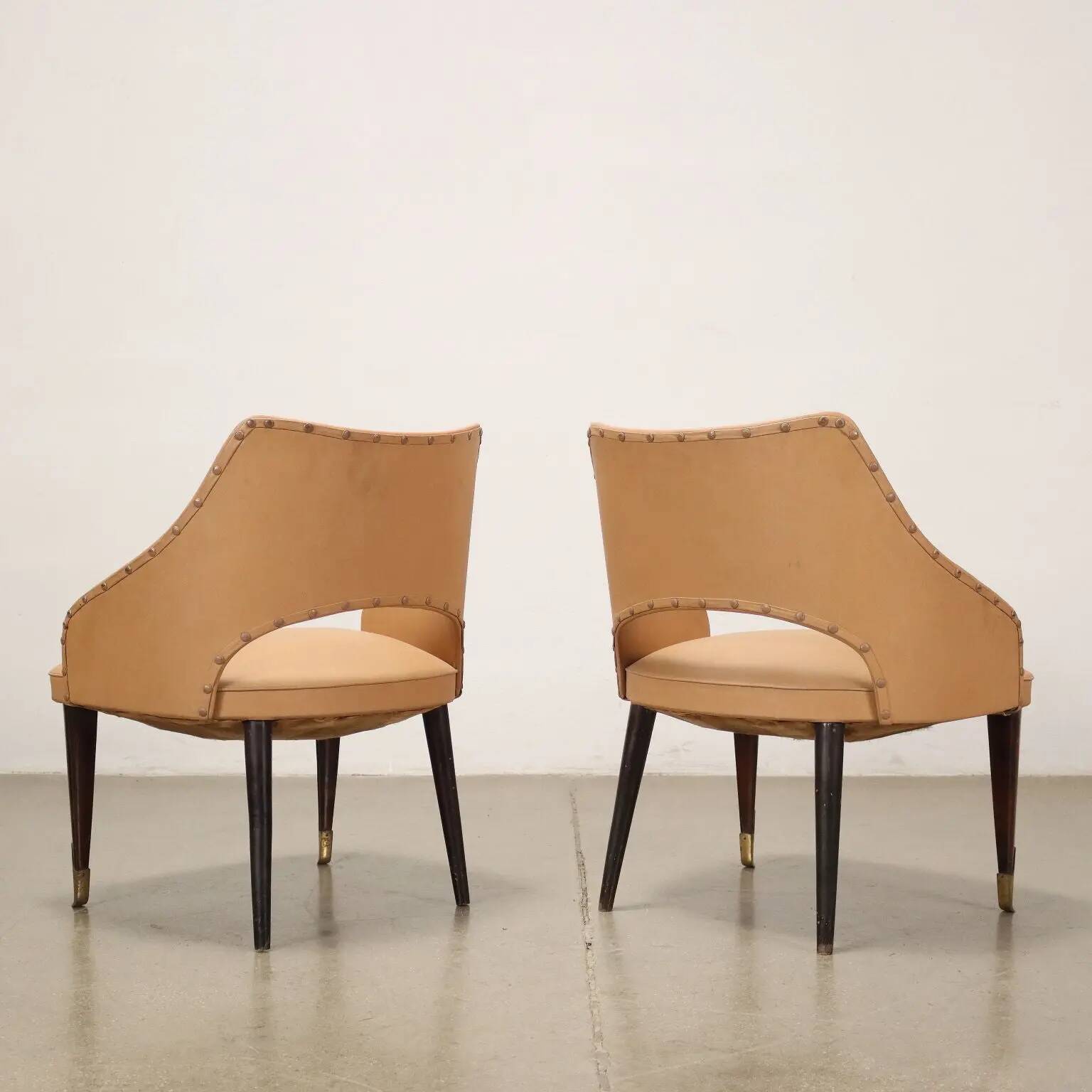 Pair of vintage armchairs from the 50s-60s in ebony wood, brass, with padded seats.