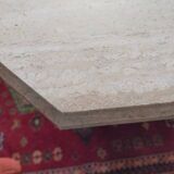 Octagonal dining table in travertine