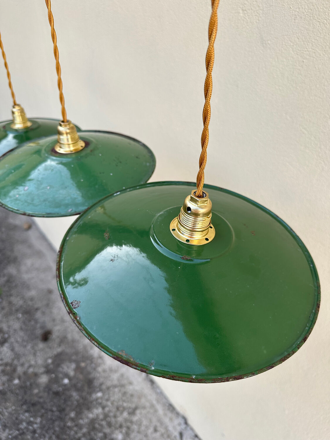 Trio of vintage pendant lights in green and white enameled sheet metal, industrial farmhouse decor