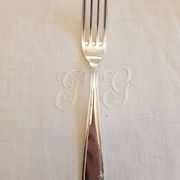 Silver cutlery set for 36 place settings and its ladle.