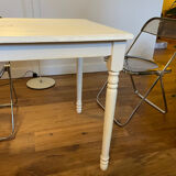 Farm table with a cream patina.