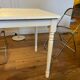 Farm table with a cream patina.