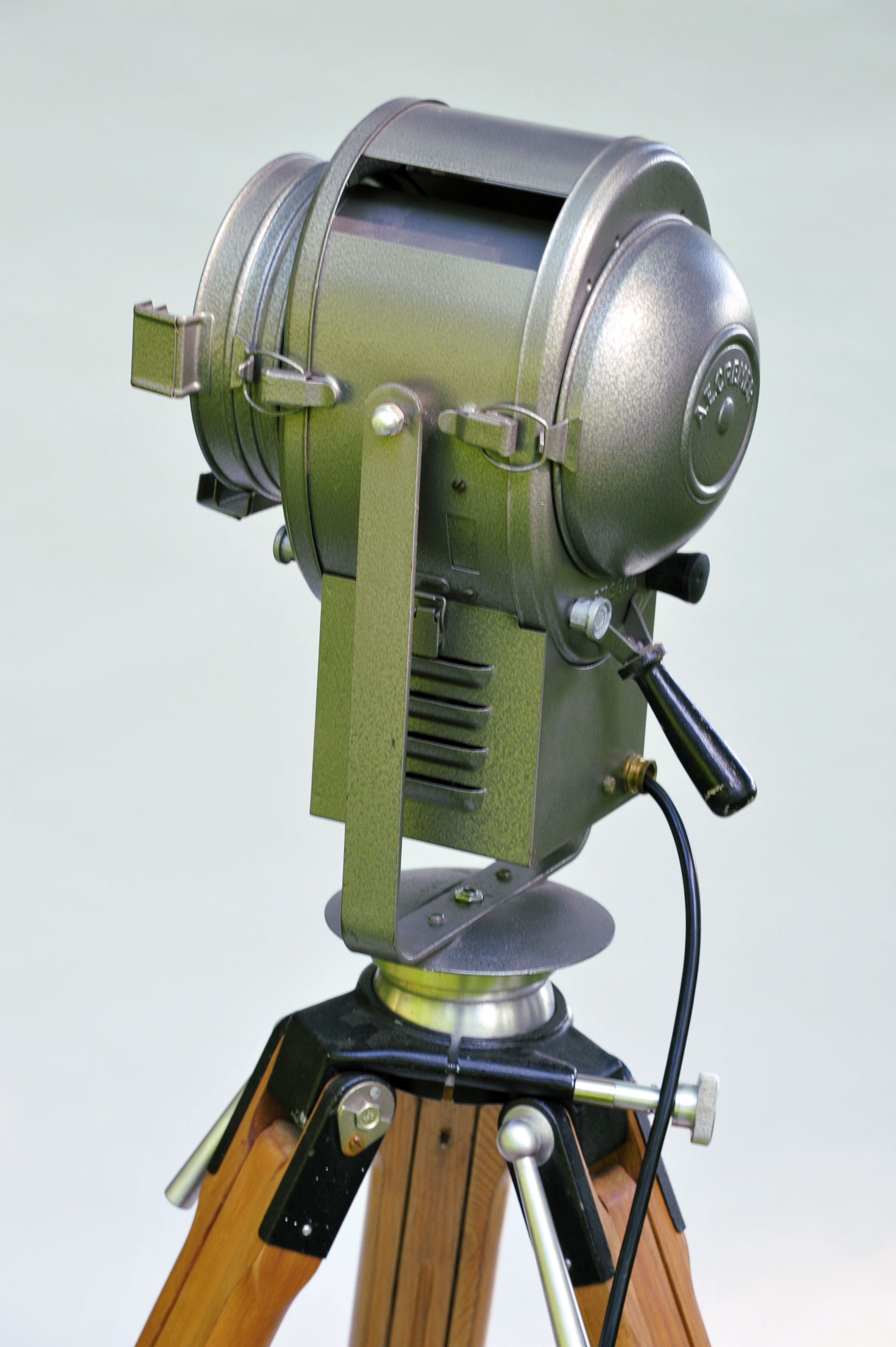 Cremer cinema projector on wooden tripod