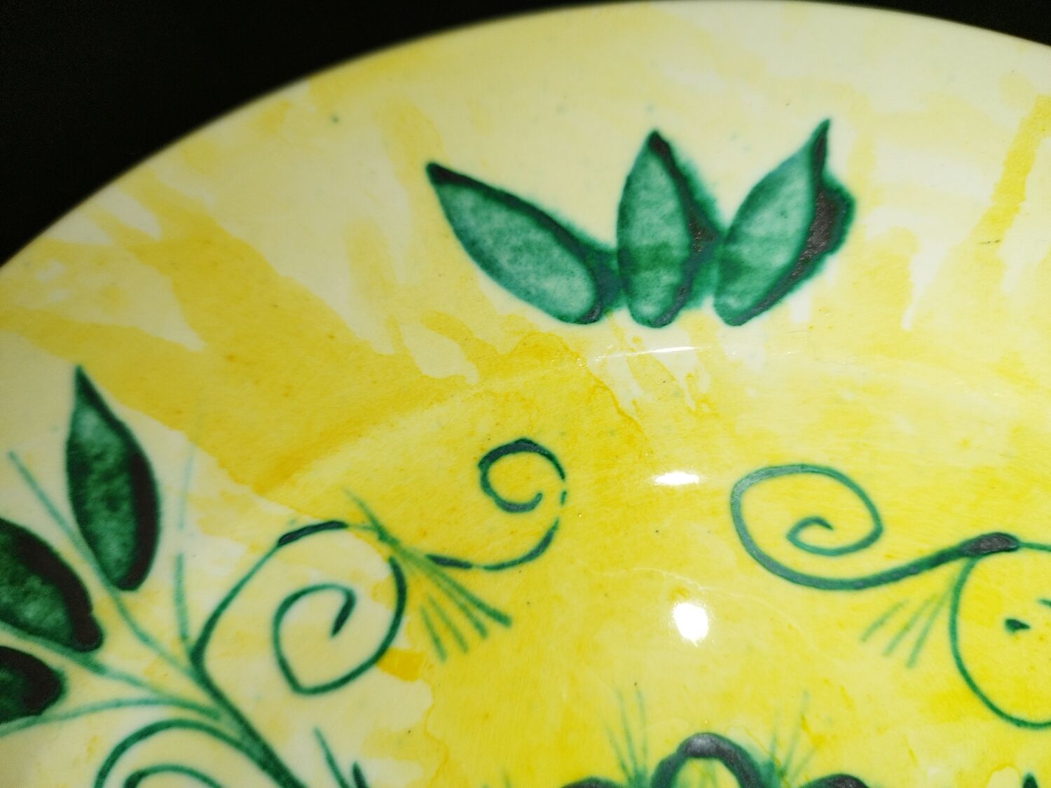 Plate decorated with yellow and green flower, signed Kerbigot.