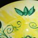 Plate decorated with yellow and green flower, signed Kerbigot.