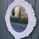 Oval mirror with white frame
