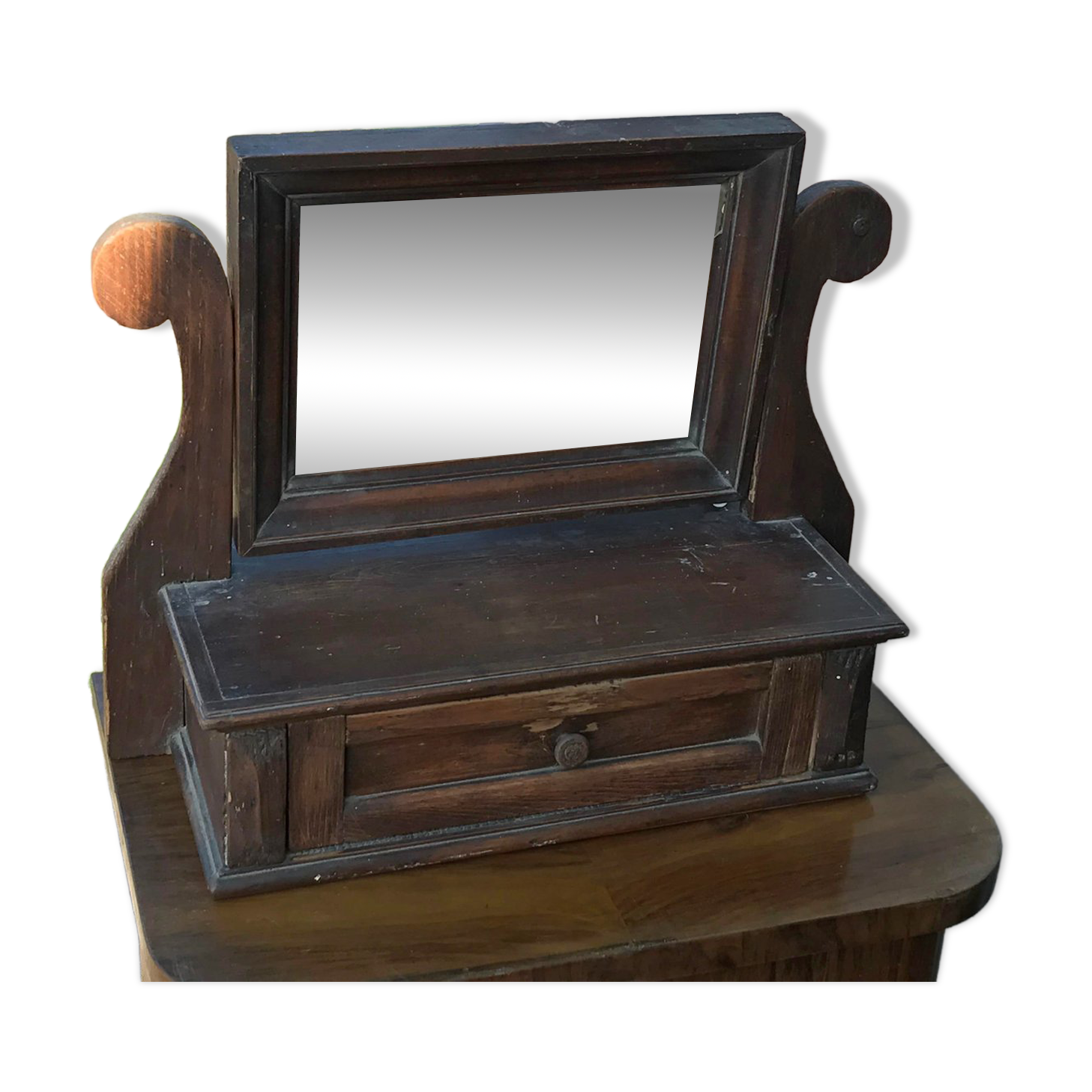Rustic brown pine mirror, 1920s German style with decorative drawer casing.
