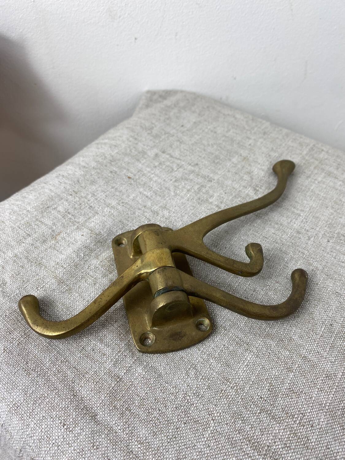 Three-pronged folding brass coat hook