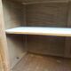 Charming vintage display cabinet from the 1950s in natural wood.