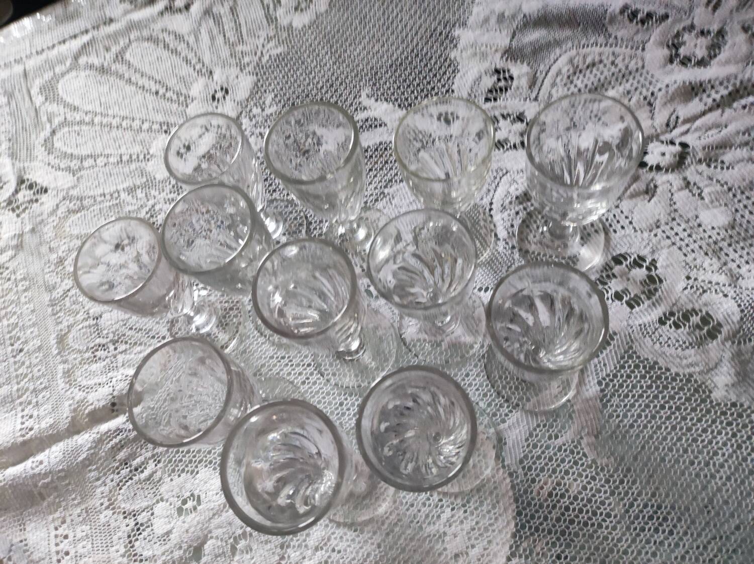 12 small twisted bistro glasses, 19th century