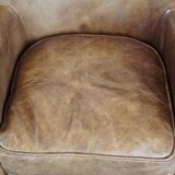Fauteuil en cuir subtil avec coussin d'assise réversible en kilim
