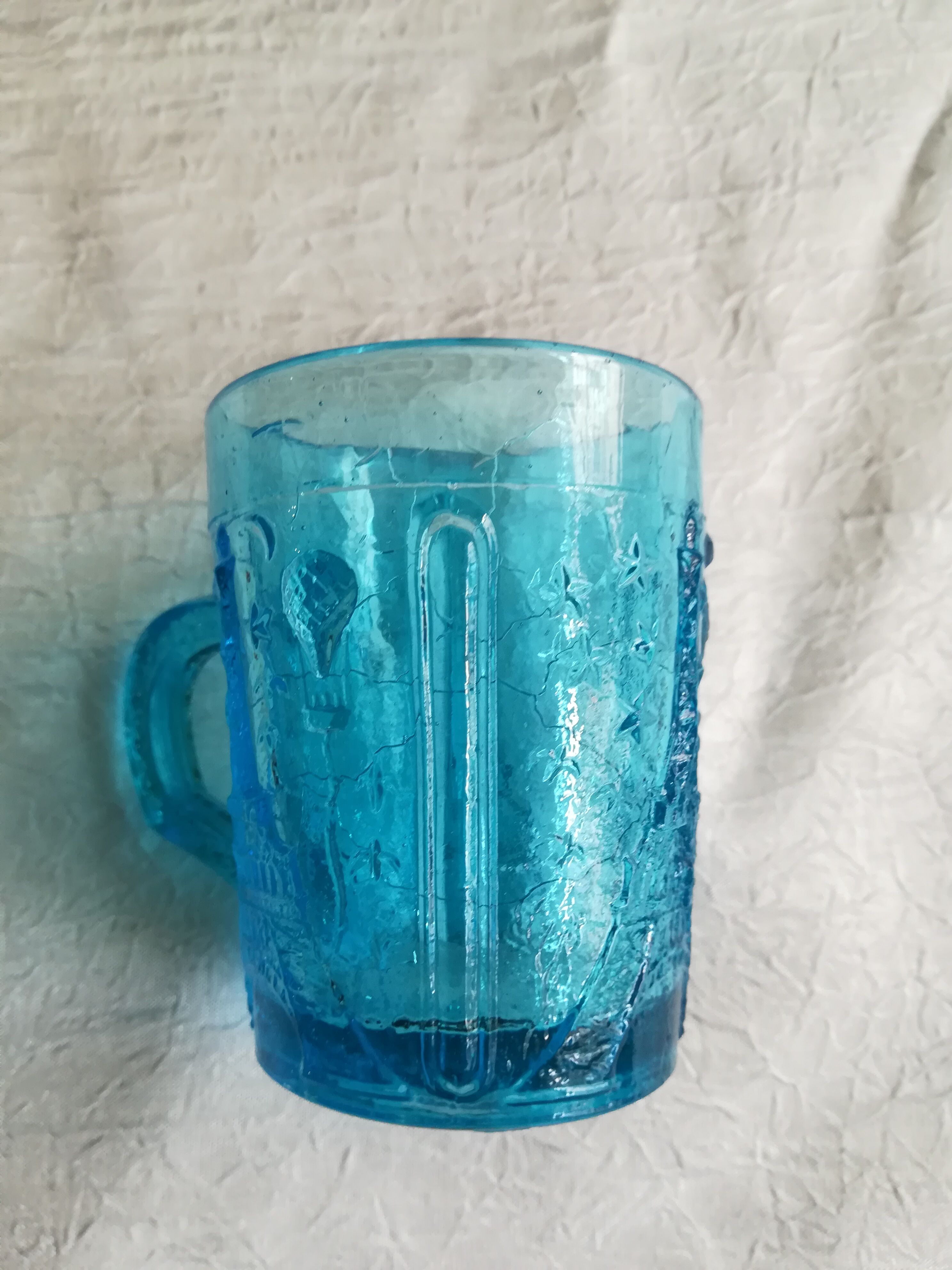 Old turquoise glass cup