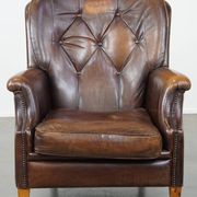 Vintage sheepskin armchair in a dark cognac colour with a comfortable seat
