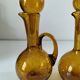 Duo of blown glass carafes – Biot signed – Bubbled amber glass