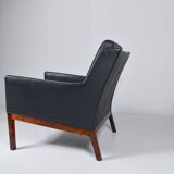 Leather and rosewood armchair by Kai lyngfeldt-Larsen. Denmark