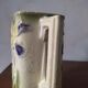 Art Nouveau pitcher in slip