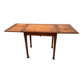 Old table with integrated extensions