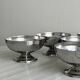 Set of 6 low footed bowls in mirror stainless steel.