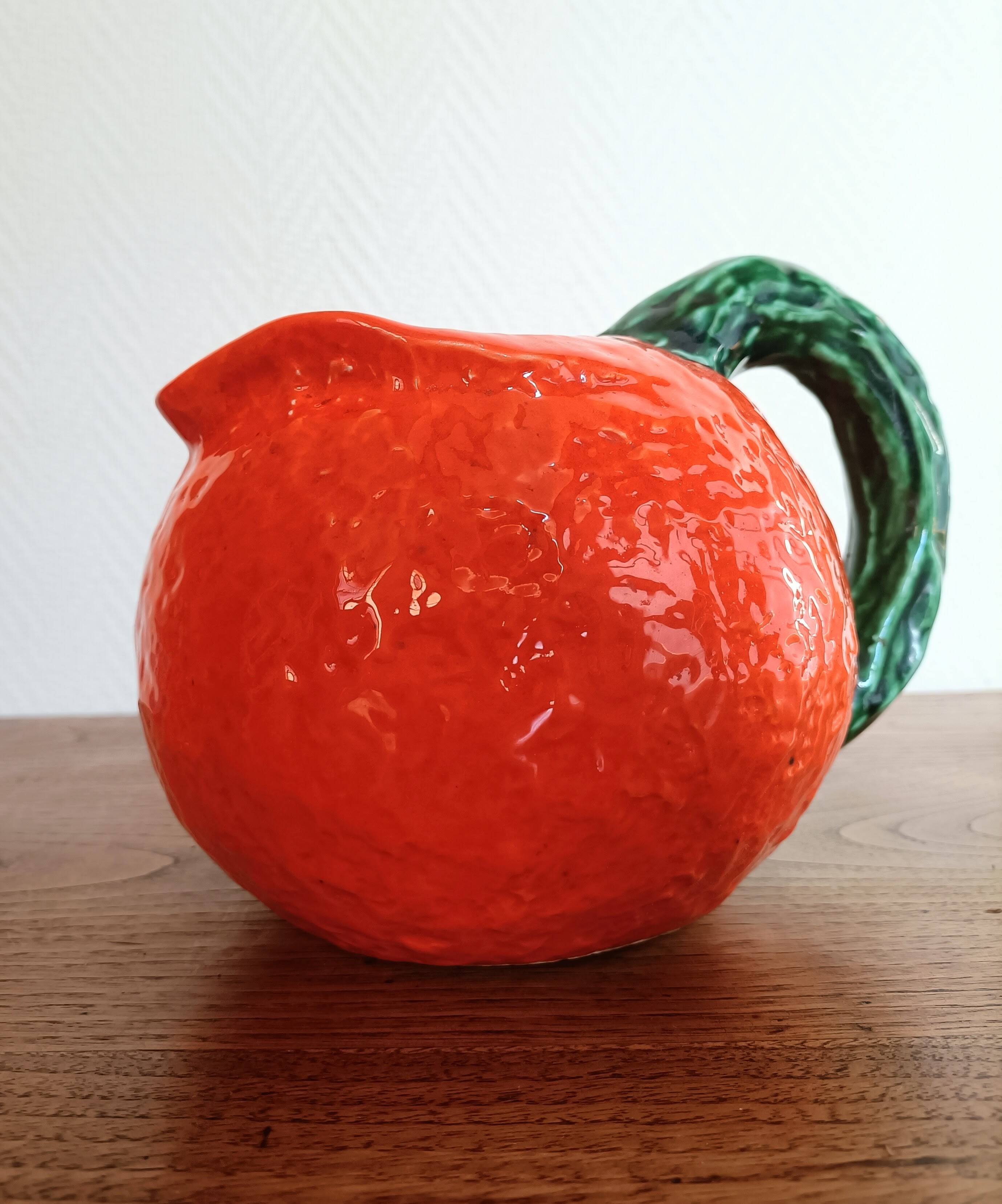 Orange pitcher in Corsican slip