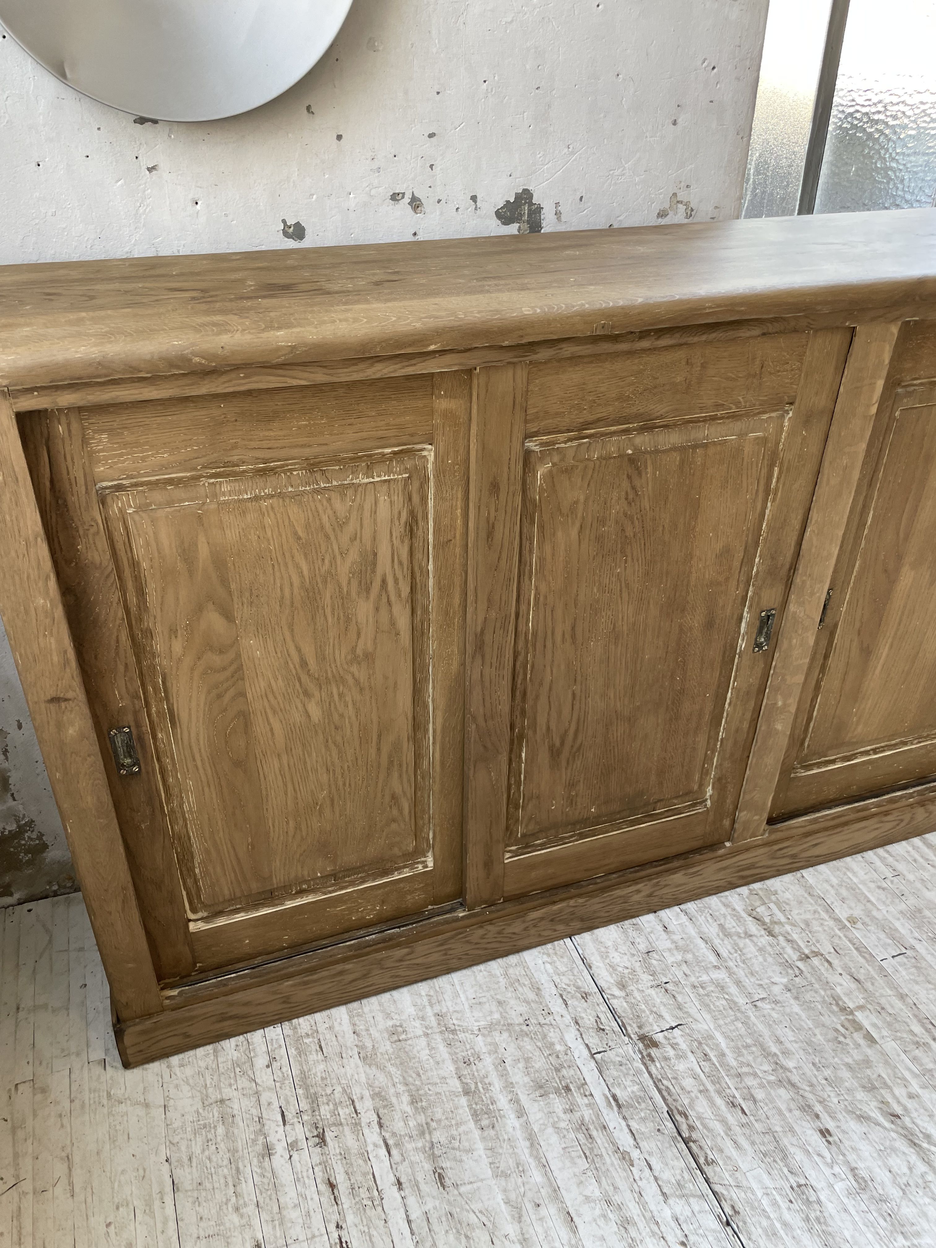 Large row of solid oak loom sliding doors