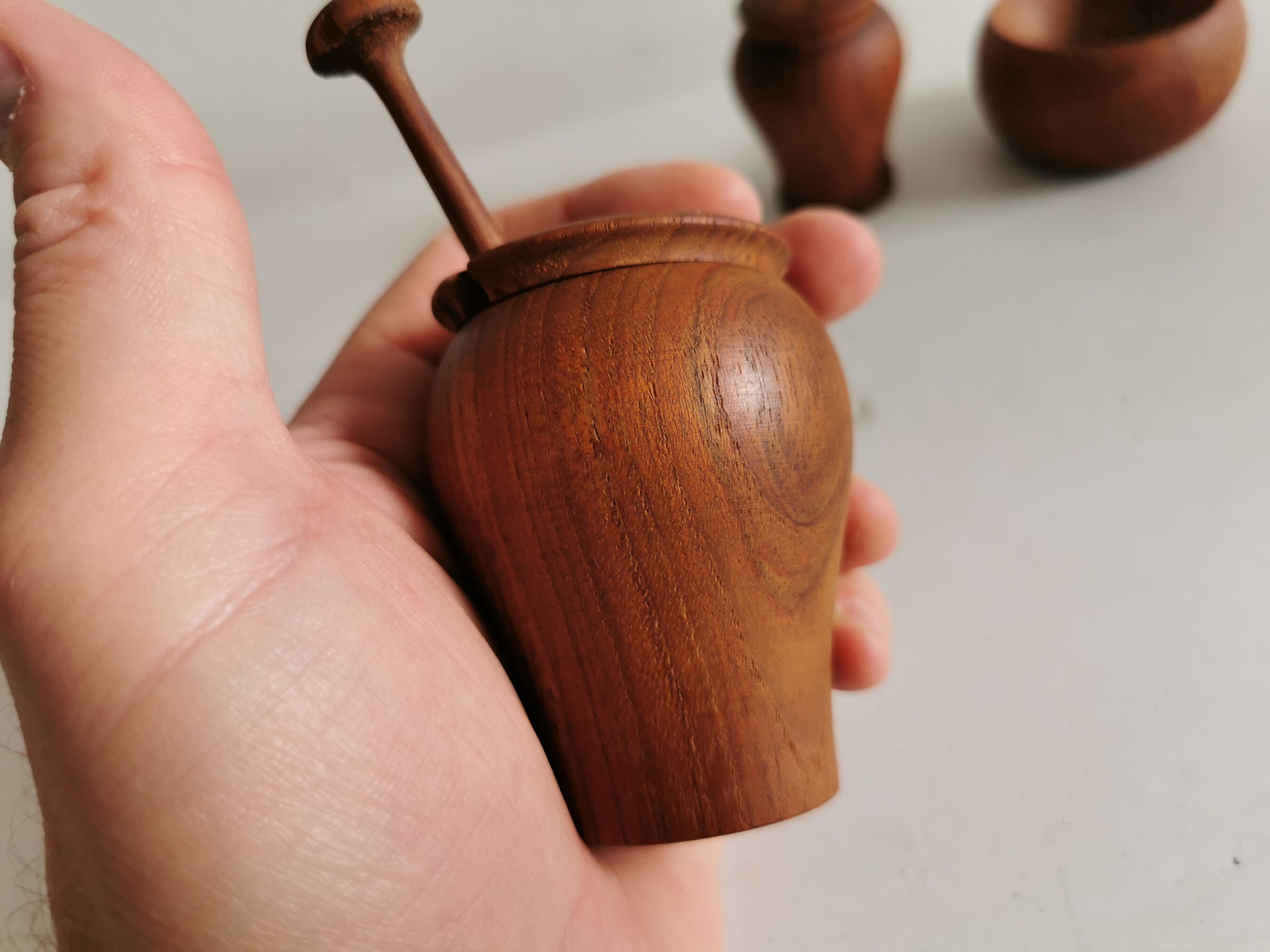 Small, beautiful lot consisting of a salt cellar, pepper shaker and honey jar.