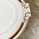 Round dish with ears in white and gold porcelain