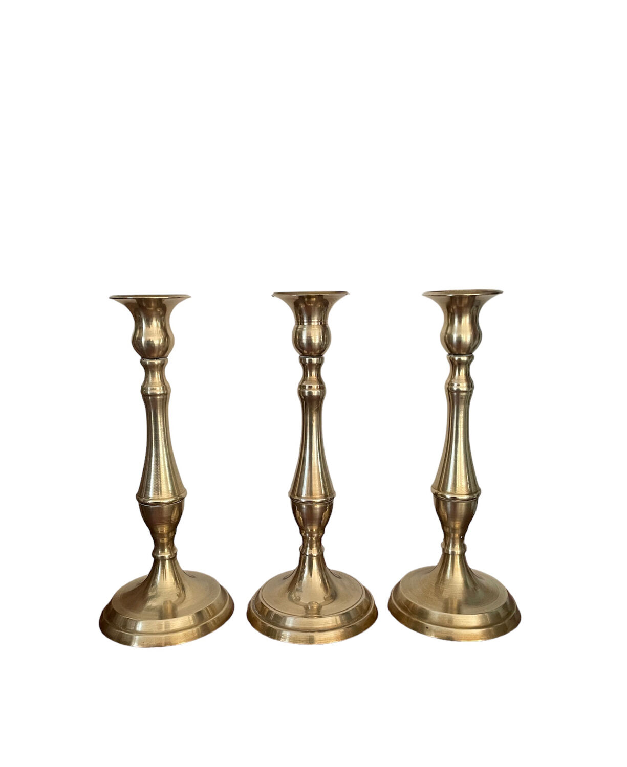 Set of three vintage brass candlesticks