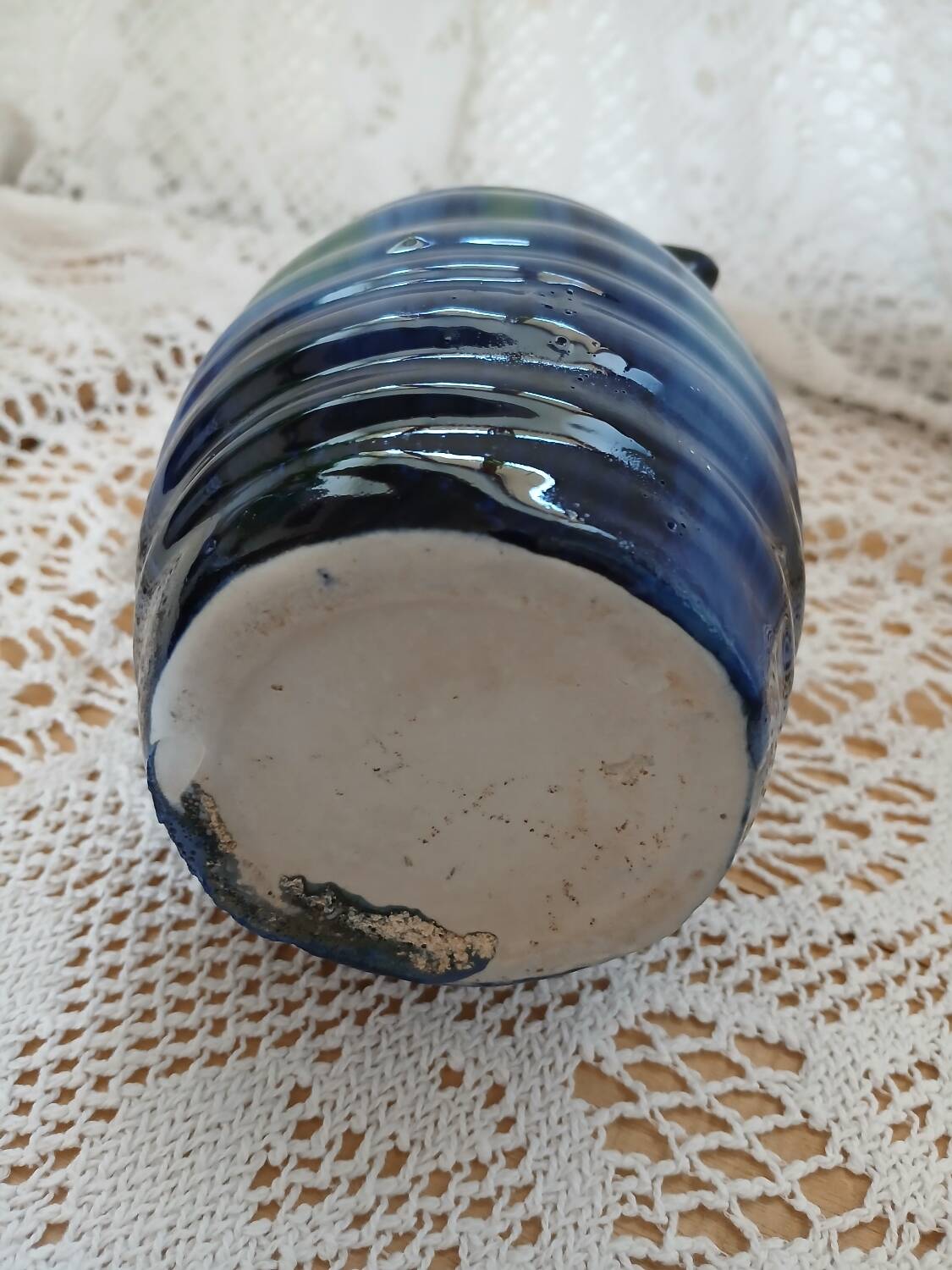 Antique pitcher in enamelled ceramic