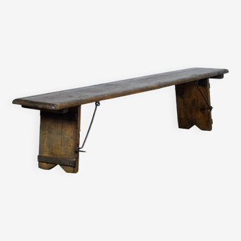 Pine bench with folding legs, circa 1900