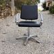 Futuristic 90s style hairdresser's chair