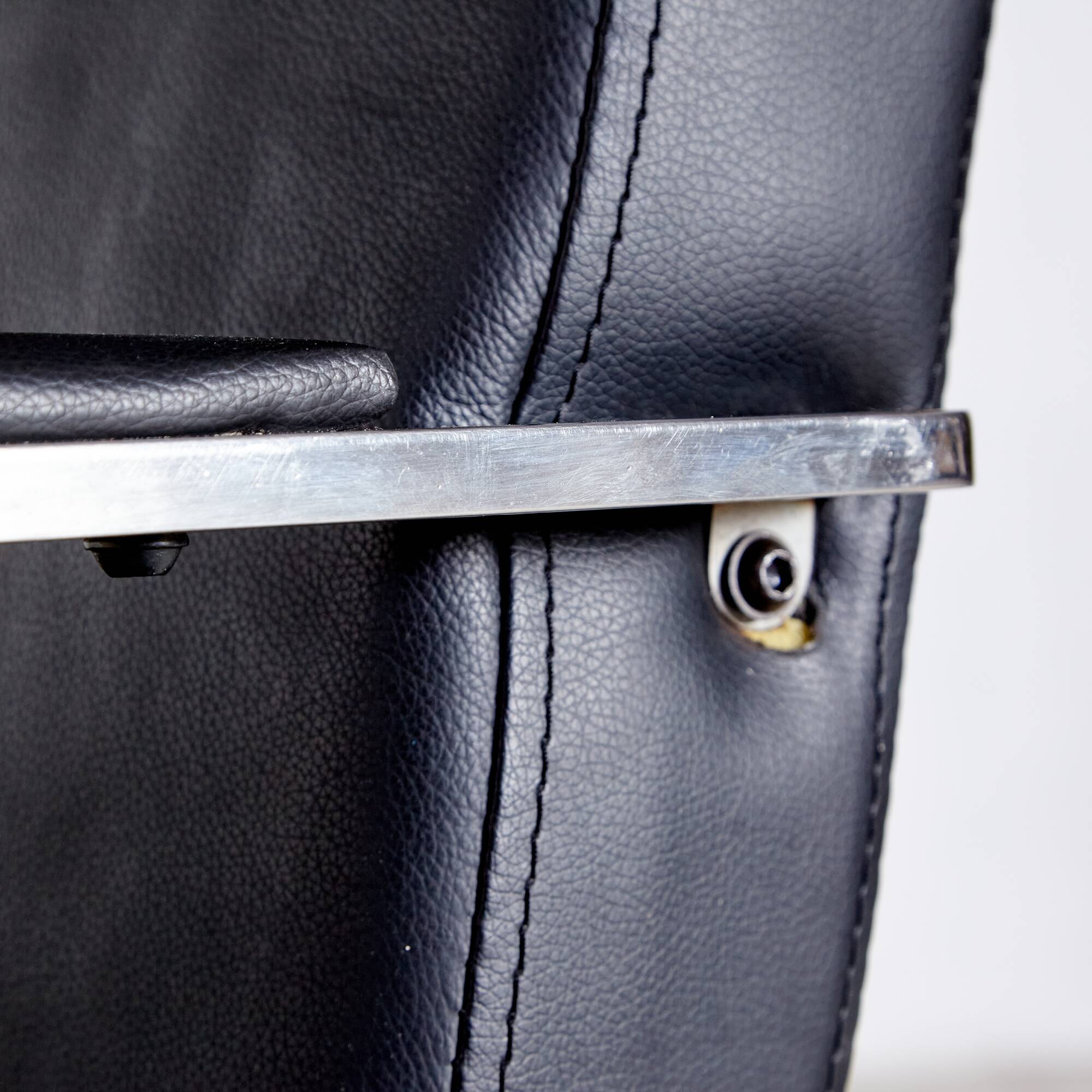 Steel armchair with leather upholstery