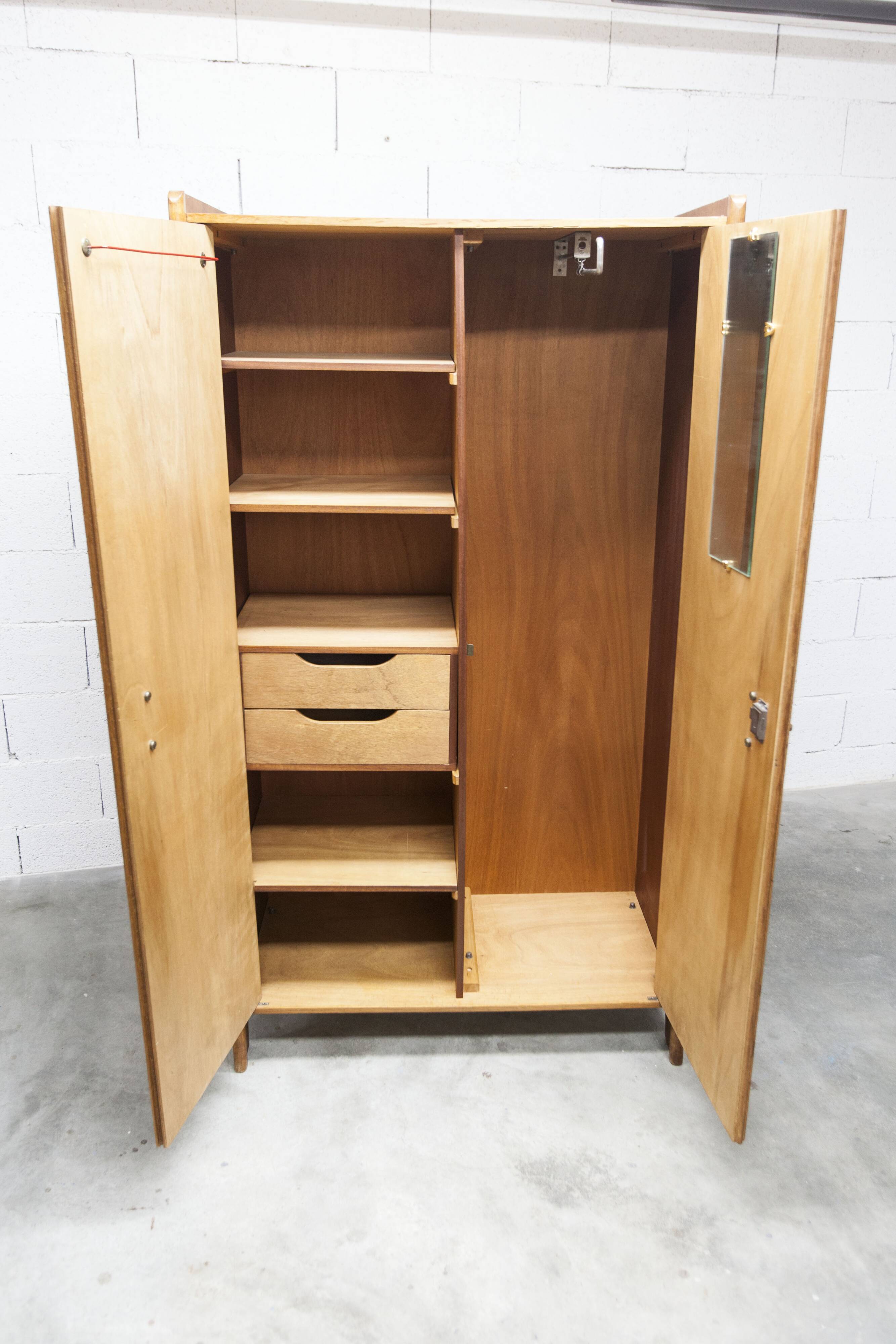 1950s Mid-Century Modern oak armoire with two doors and two drawers.