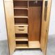 1950s Mid-Century Modern oak armoire with two doors and two drawers.