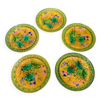 Lot de 5 assiettes en céramique avec des motifs fleuries jaunes et verts.