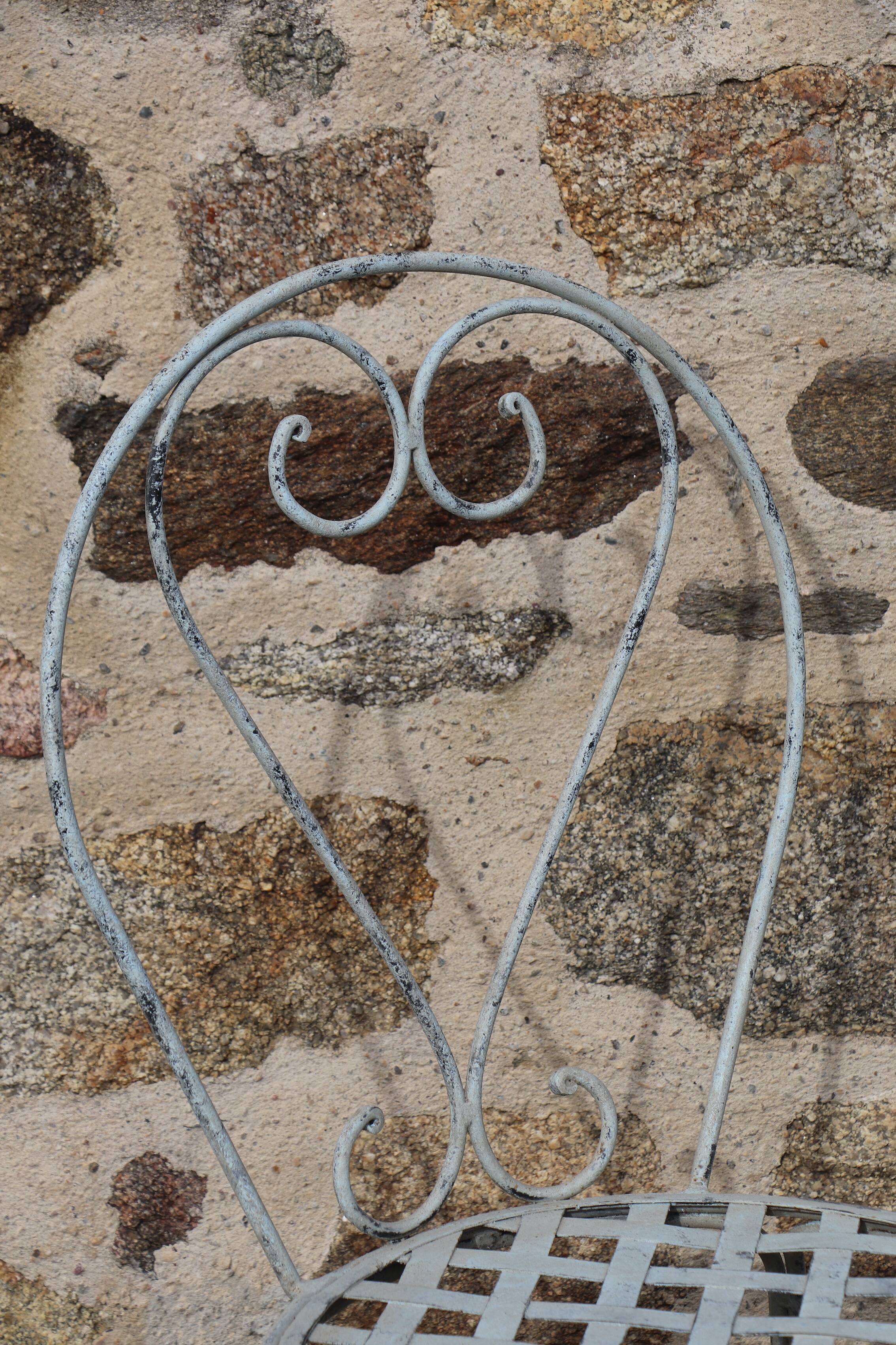 Series of 6 wrought iron garden chairs