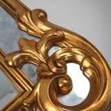 Richly decorated wall mirror in resin with golden ornaments and smoked mirror glass panels, Belgium,
