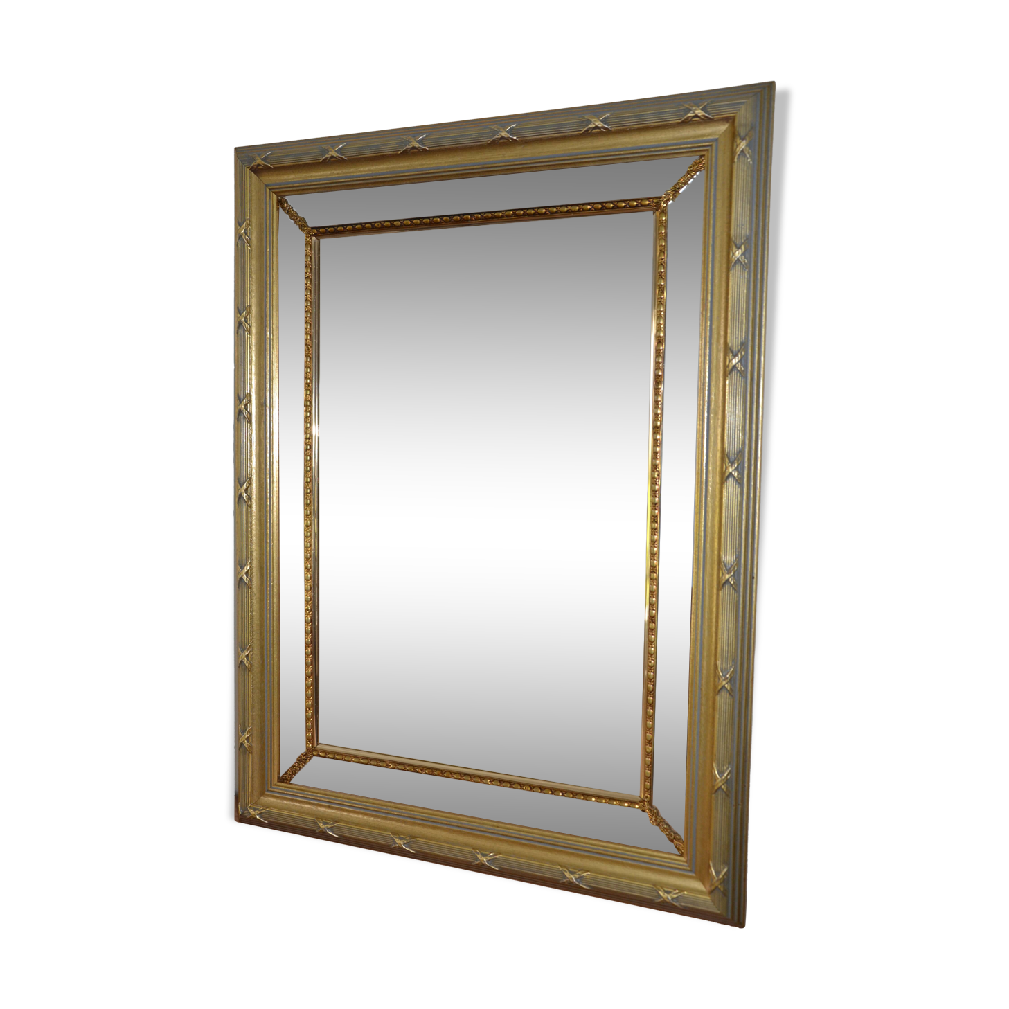 Large mirror with wooden gilded and carved frame.