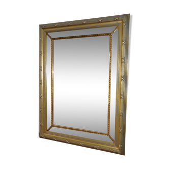 Large mirror with gilded and carved wooden glazing beads