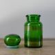Green vintage apothecary pot and golden ledé